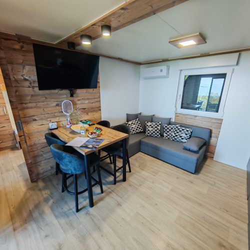 Luxurious interior of SparkleTT mobile home in Klenovica with wooden details and panoramic sea view
